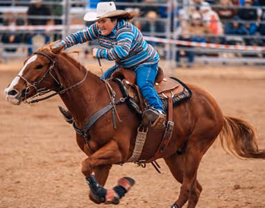 A woman riding a horse at the Cunnamulla Fella festival.